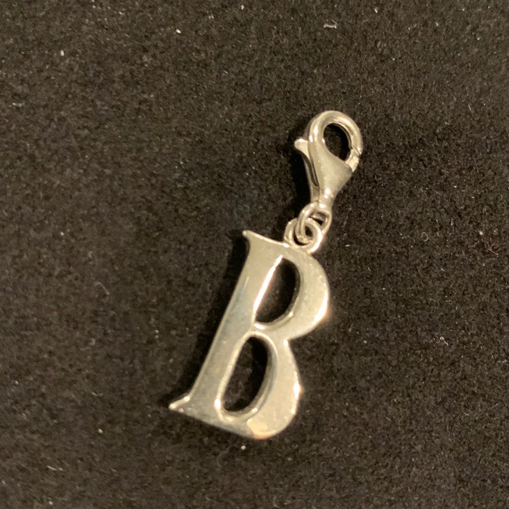 Silver “B” charm with claw clasp.